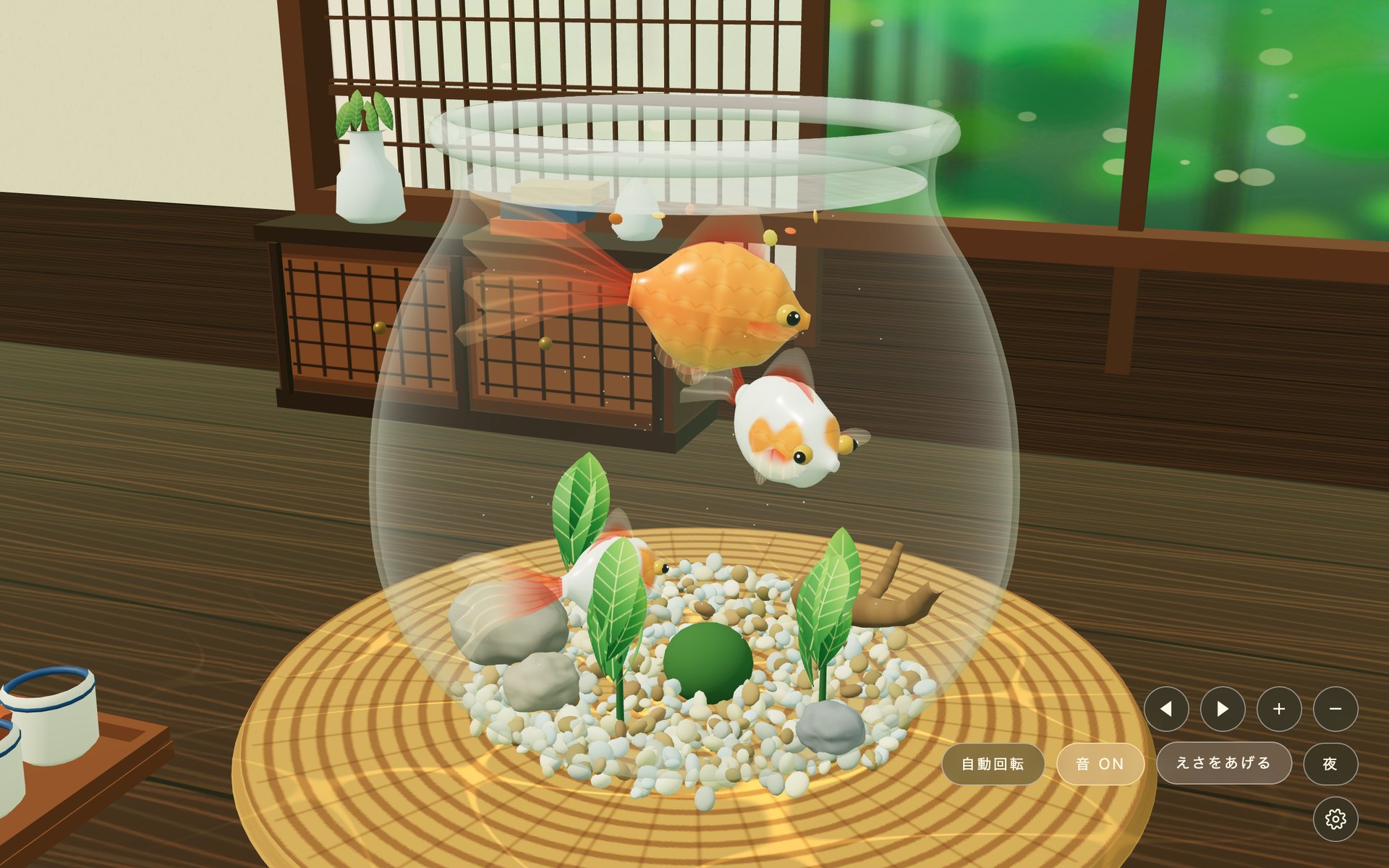 えさをあげた直後の金魚鉢。水面に落ちたえさのフレークに、金魚が近づいている